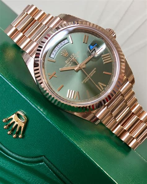 gold rolex green face day date